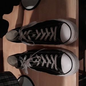 Converse, high top, black and still many miles on them as you can see. Size 13.